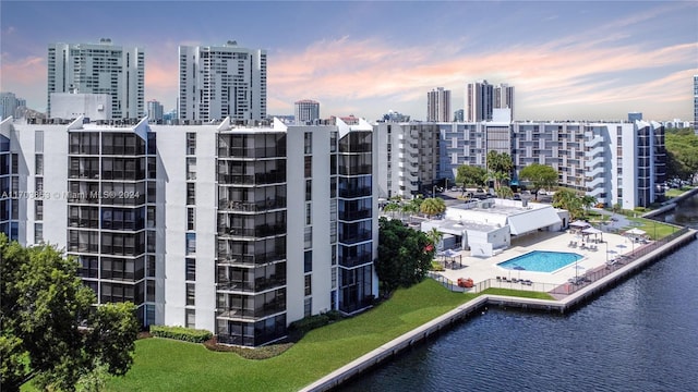 3475 N Country Club Dr Unit 503, Aventura, FL 33180 - aerial view at dusk of a view of skyline, view of pool area, and a water view