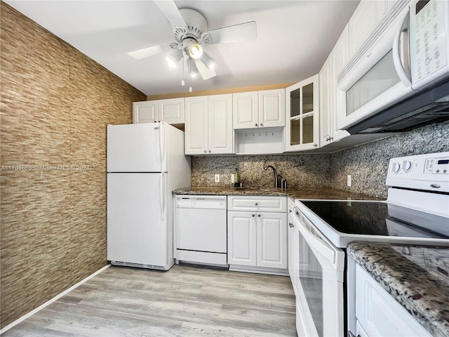 3475 N Country Club Dr Unit 503, Aventura, FL 33180 - kitchen featuring white appliances, decorative backsplash, ceiling fan, white cabinetry, and glass insert cabinets