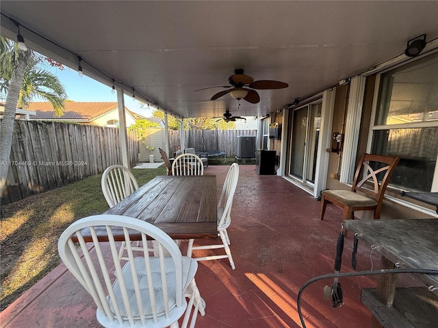 view of patio / terrace featuring ceiling fan and a storage shed