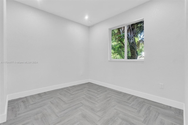 spare room featuring light parquet flooring