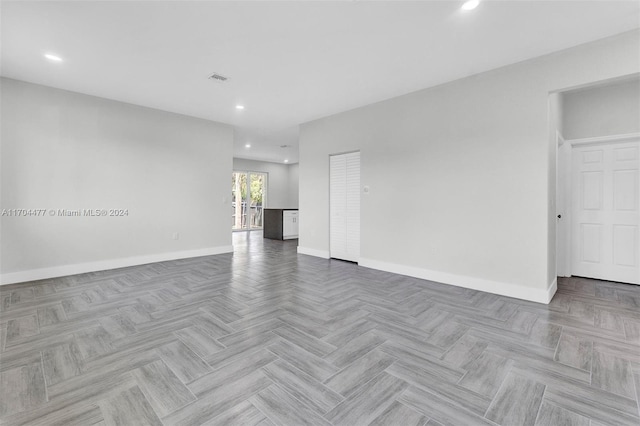 unfurnished room featuring light parquet floors