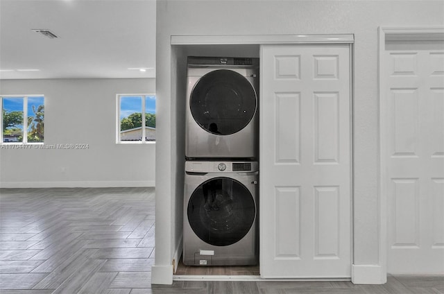 laundry room featuring stacked washer and clothes dryer