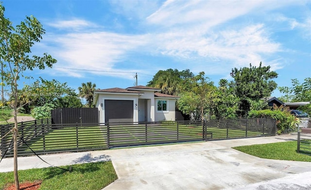 view of front of house with a garage and a front lawn