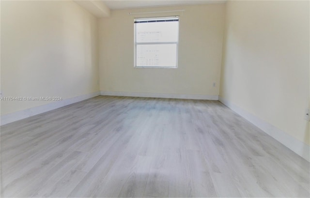 empty room with light wood-type flooring