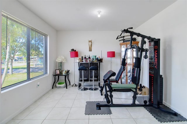 workout room with light tile patterned floors