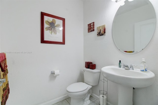 bathroom featuring tile patterned flooring and toilet