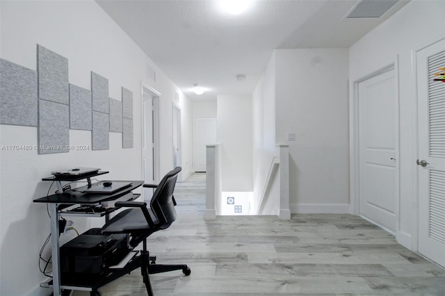 office area with light hardwood / wood-style flooring