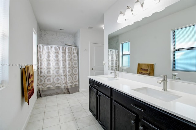 bathroom with tile patterned floors, vanity, and shower / bath combo