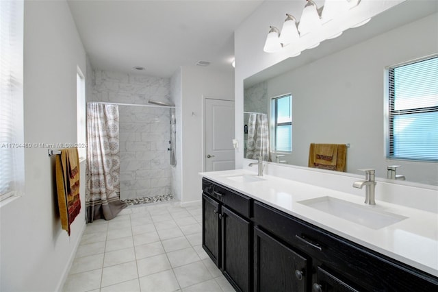 bathroom featuring a shower with shower curtain, vanity, and tile patterned floors