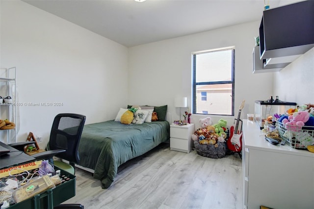 bedroom with light hardwood / wood-style floors