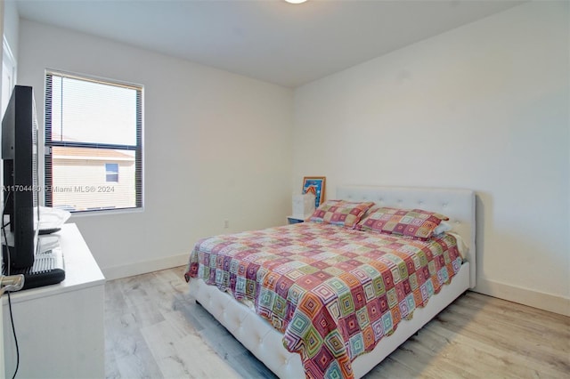 bedroom with light hardwood / wood-style floors