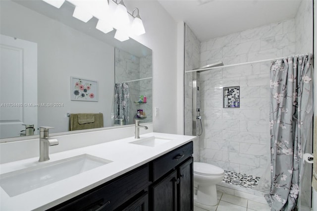 bathroom featuring a shower with shower curtain, vanity, tile patterned floors, and toilet