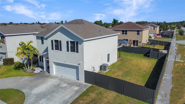 view of side of home featuring a garage, central AC unit, and a lawn