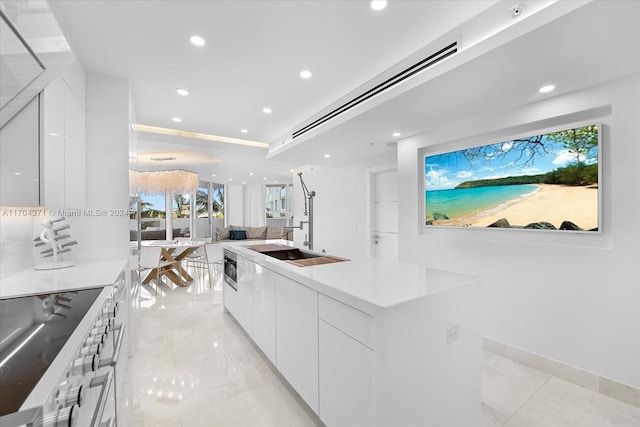 kitchen featuring appliances with stainless steel finishes, a center island, and white cabinetry