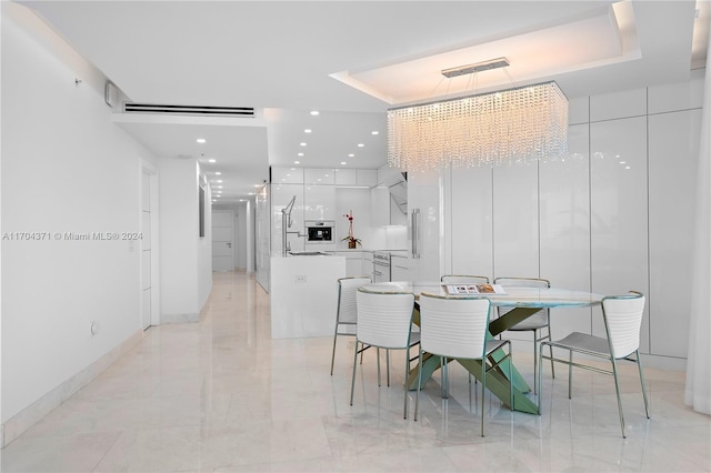 dining space with a tray ceiling