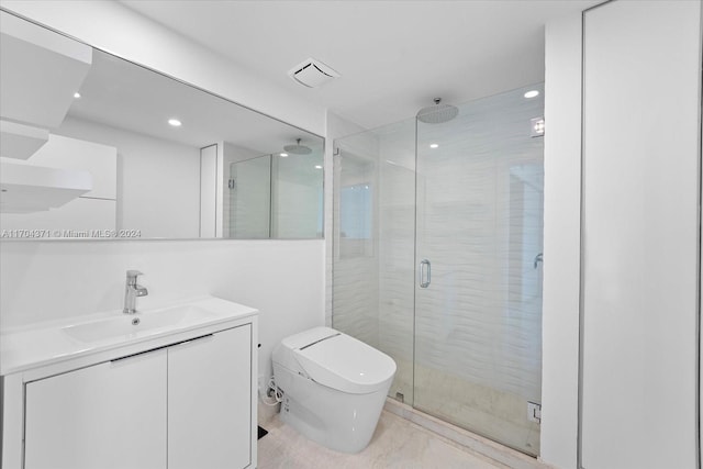 bathroom featuring toilet, vanity, and walk in shower