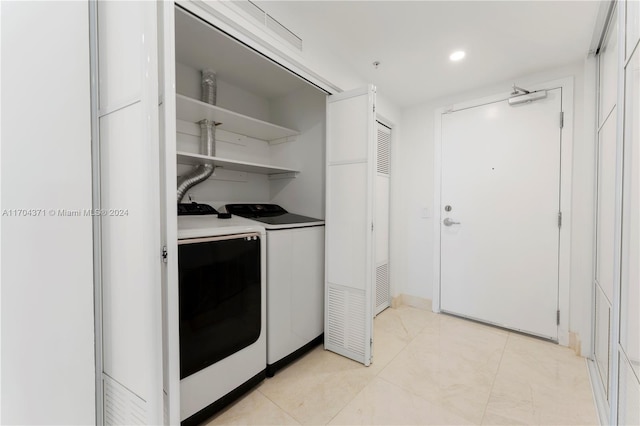 laundry area with washer and clothes dryer