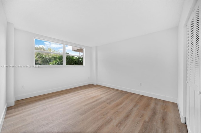 unfurnished bedroom featuring light wood-type flooring