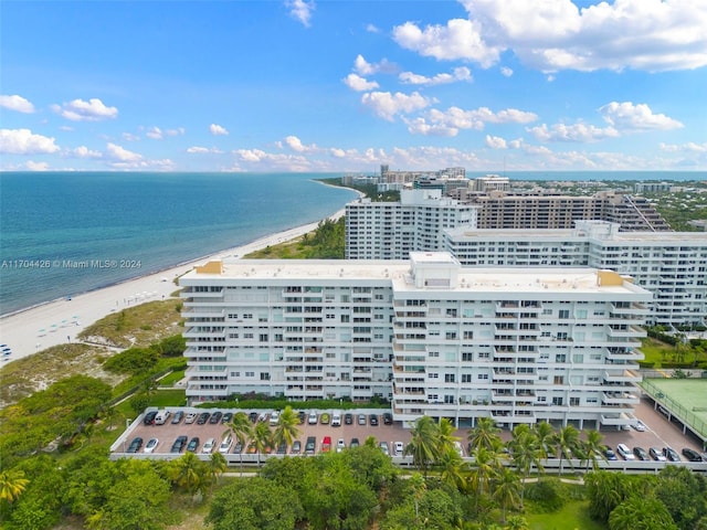 bird's eye view featuring a water view and a view of the beach