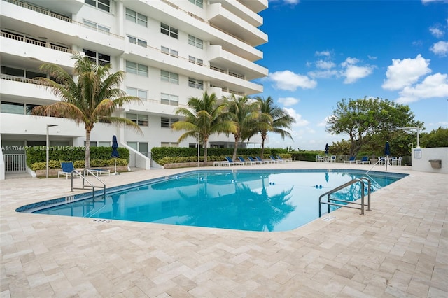 view of pool featuring a patio area