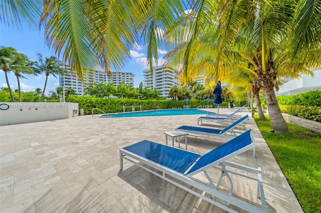 view of swimming pool with a patio area