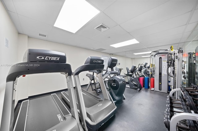 gym featuring a drop ceiling