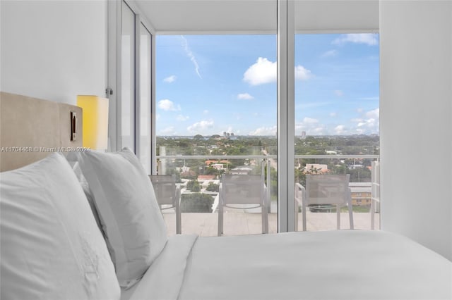 bedroom featuring floor to ceiling windows