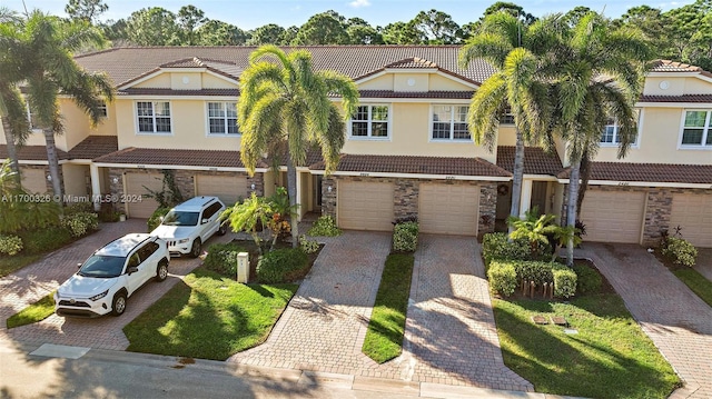 view of front facade with a garage and a front yard