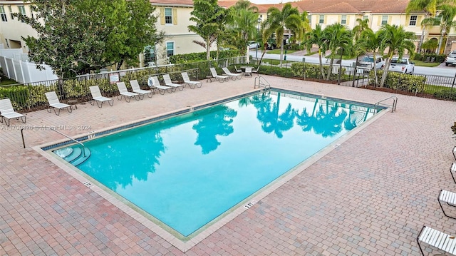 view of swimming pool featuring a patio area