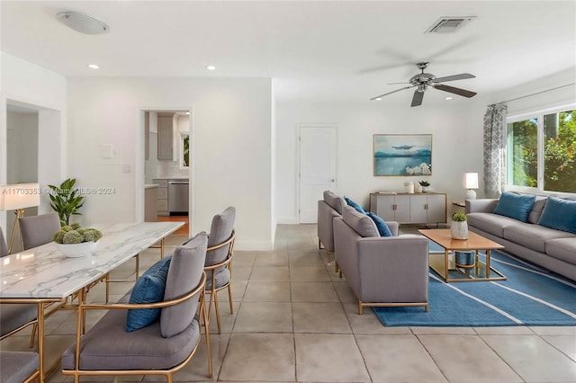 living room featuring ceiling fan and light tile patterned flooring