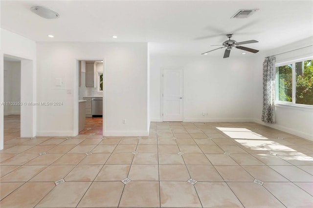 unfurnished room featuring ceiling fan and light tile patterned flooring