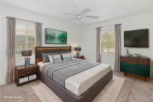 tiled bedroom with ceiling fan