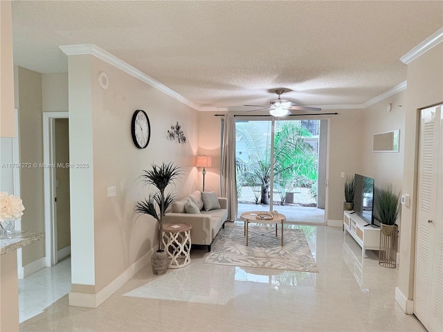 living room featuring ceiling fan, a textured ceiling, and ornamental molding