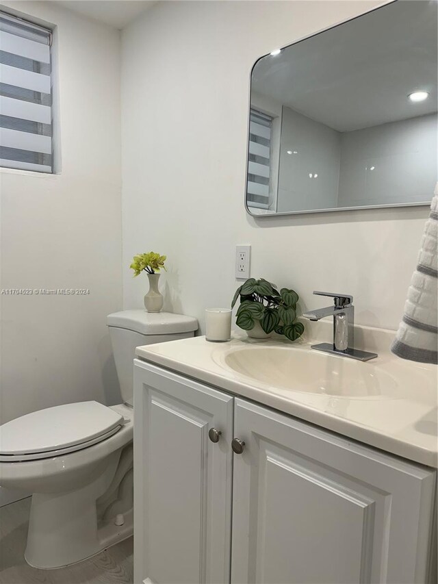 bathroom featuring vanity and toilet