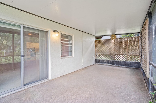 unfurnished sunroom featuring a wealth of natural light