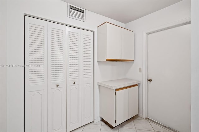 interior space featuring light tile patterned floors