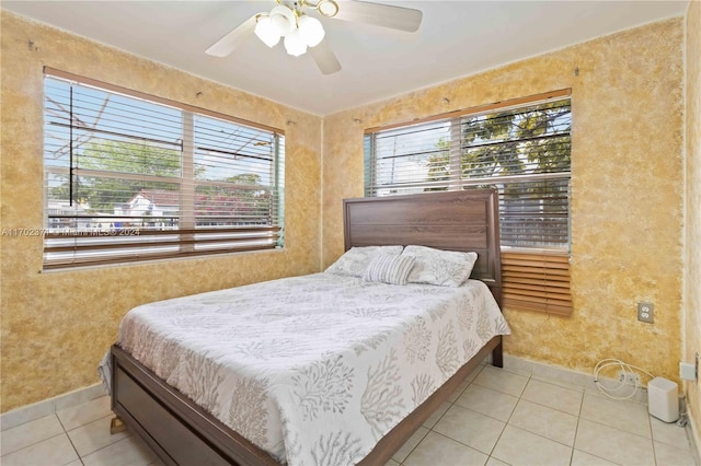 tiled bedroom with ceiling fan