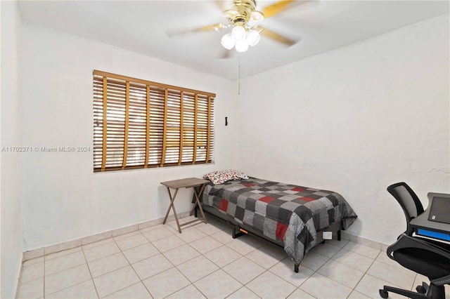 bedroom featuring ceiling fan and light tile patterned flooring