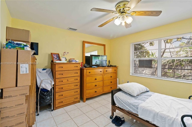 bedroom featuring ceiling fan and light tile patterned floors