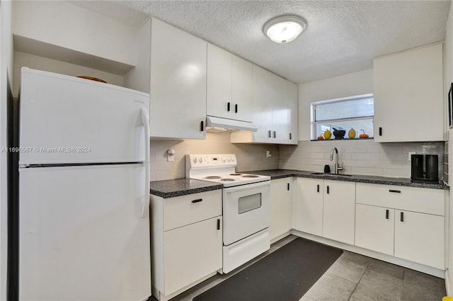 kitchen featuring white cabinetry, sink, and white appliances