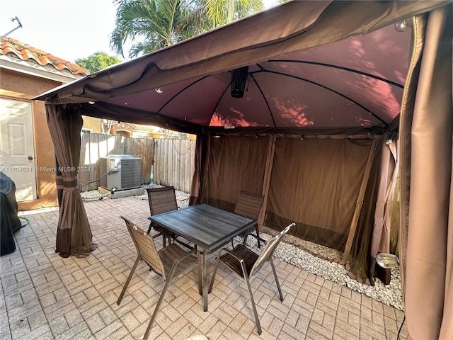 view of patio / terrace with a gazebo and central air condition unit