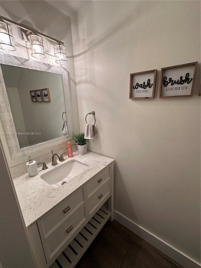 bathroom with wood-type flooring and vanity