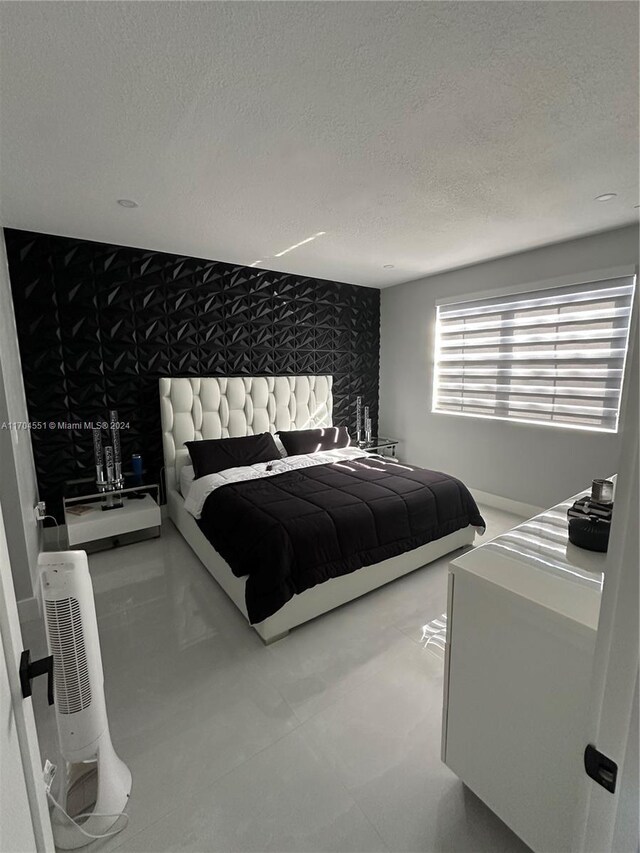 bedroom featuring a textured ceiling