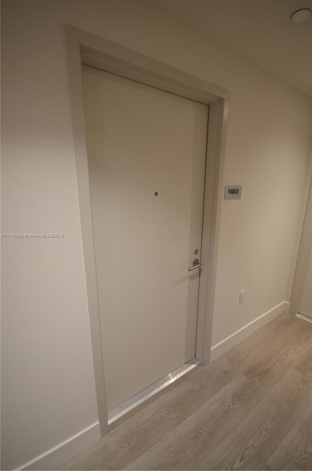 239 SW 9th St Unit 1603, Miami, FL 33130 - detailed view of wood finished floors and baseboards
