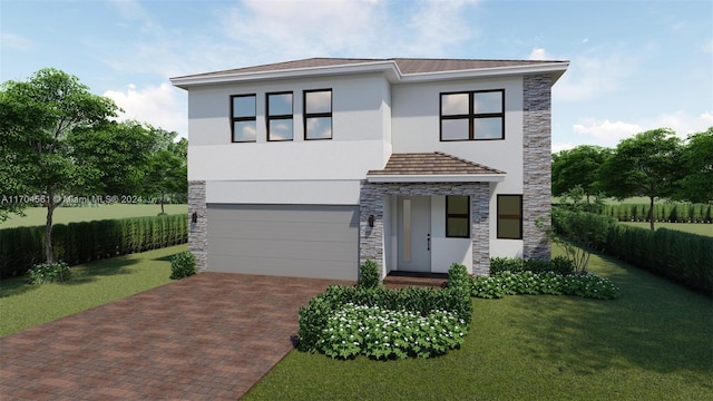 view of front of property featuring a garage and a front lawn