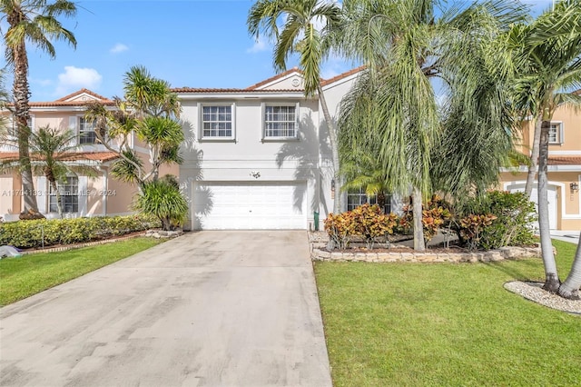 view of front facade featuring a front yard and a garage