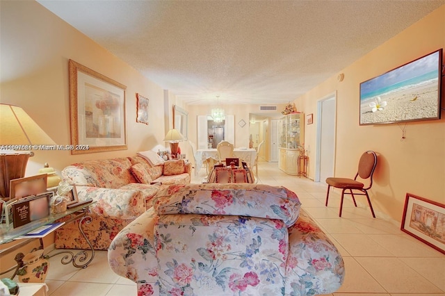 tiled living room featuring a textured ceiling