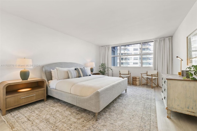 bedroom with light hardwood / wood-style floors