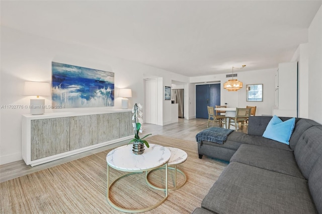 living room with light hardwood / wood-style flooring