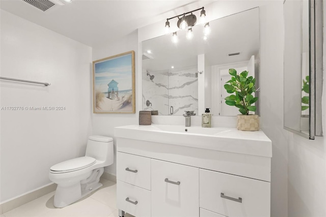 bathroom featuring tile patterned flooring, vanity, toilet, and walk in shower